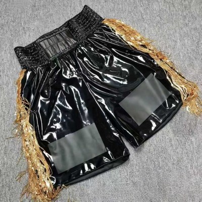 Black Glossy Boxing Shorts with Gold Fringe Accents & Custom Patch Areas Fight Trunks